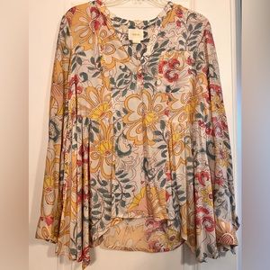 Leave blouse size 4. It’s so cute with denim shorts in the spring.